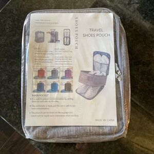 Travel shoe pouch. 3 separate compartments. Slide on carry on.NEW never opened